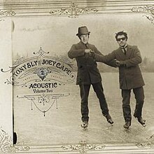 A sepiatone photo of two men in suits iceskating with the artists' faces superimposed on top