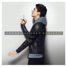 Maynard stands side-on to the camera against a white background. He wears a black leather jacket over a blue hoodie, and is pointing his index finger upwards. Across the centre of screen is the name "Conor Maynard", and the title "Contrast".