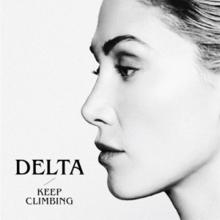 A black-and-white side profile portrait of a woman, with her hair pulled back from her face, with the words "Delta" and "Keep Climbing" written.