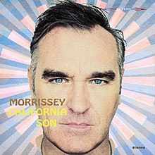 A close-up picture of Morrissey's face in front of a pink and blue background. The artist name and album title are written over the left side of his face in all caps.