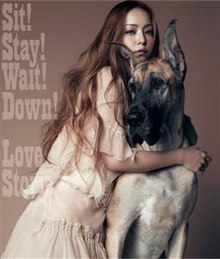 Namie Amuro kneeling down, hugging a Great Dane