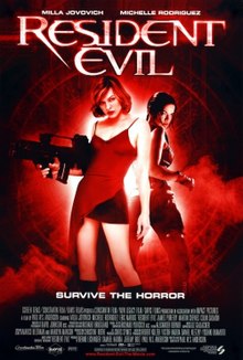 A black and red picture shows Alice standing back to back with Rain. Alice is holding a machine gun and wearing a red dress, cutaway showing a skirt. The tagline below reads "Survive the horror".