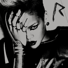 A black-and-white image of a woman wearing a leather jacket. Her hair is side-shaved, wears dark lipstick and her eye is covered with her hand. In the upper right corner there is a metal 'R' sign, while in the bottom right corner the words 'Rated R' are written in white letters.