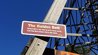 A plaque commemorating the "golden bolt", a bolt salvaged from the original Mister Twister and installed into the structure of the swoop curve