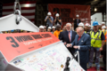 Developer Larry Silverstein and construction workers sign the last bucket of concrete during the topping-off ceremony on June 23, 2016.