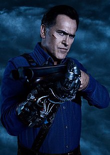 Campbell as Ash Williams holding a gun