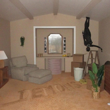 Cover art for "Demons": Doja Cat, who appears as a black demon, stands upside down on a living room ceiling, with the song title on the carpet floor