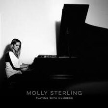 The cover artwork for "Playing with Numbers". The cover features Molly Sterling playing piano under a black-and-white filter.