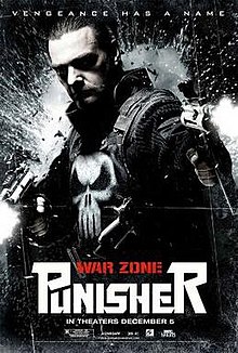 Official graphic poster of the film, shows the Punisher in his traditional vest and logo, holds two guns and looks toward the viewer, with the film's title and credits below him.