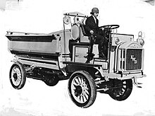 Promotional photo of Luella Bates driving a FWD model B truck.