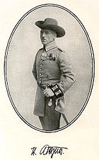 A man posing in an old uniform