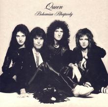 The four members of the band sit together in front of a sandy-coloured background wearing predominantly black clothing. Mercury appears to be the dominant figure, sat in front of the other three members. From left to right, John Deacon, Mercury, Brian May, Roger Taylor. All four individuals are looking directly at the camera with a neutral expression on their face. Above the band is some black text, printed in an elegant, italic font face. The word "Queen" followed by "Bohemian Rhapsody", the latter of which is positioned under the band name in the same format yet smaller font.